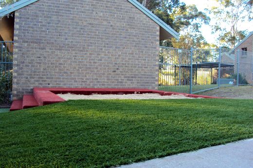 CHILDCARE CENTER PLAYGROUND GRASS AND SANDPIT